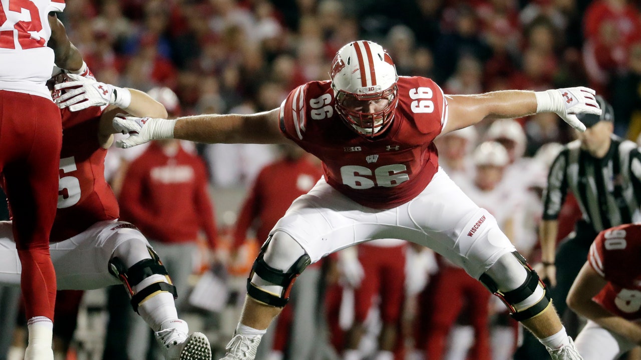 Badgers' blockers open holes, then enjoy watching Taylor